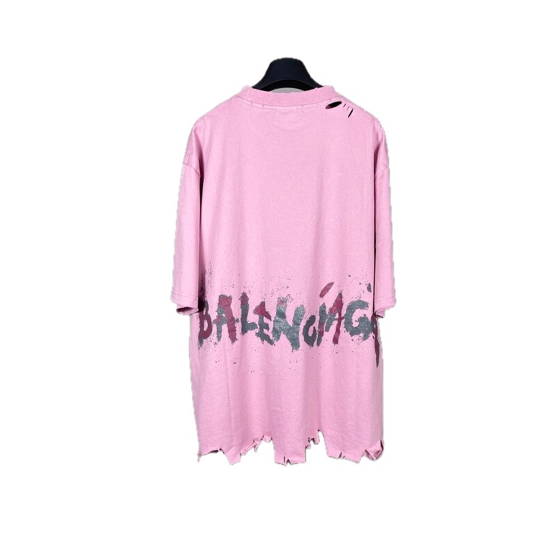 Balenciaga's pink T-shirt with a hole and graffiti style