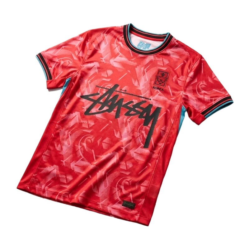 Red clothing with Stussy graffiti trendy style