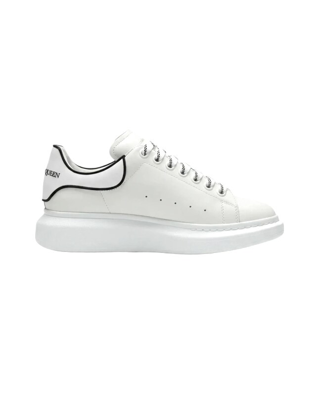 The minimalist style of McQueen white sneakers.