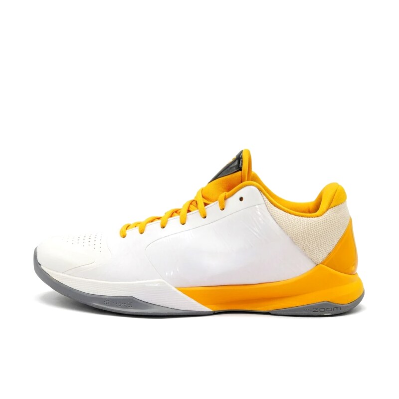 White and yellow color scheme of Nike basketball shoes